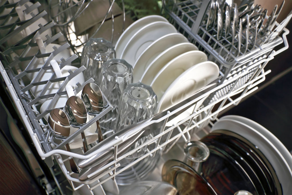 open dishwasher with clean plates in it