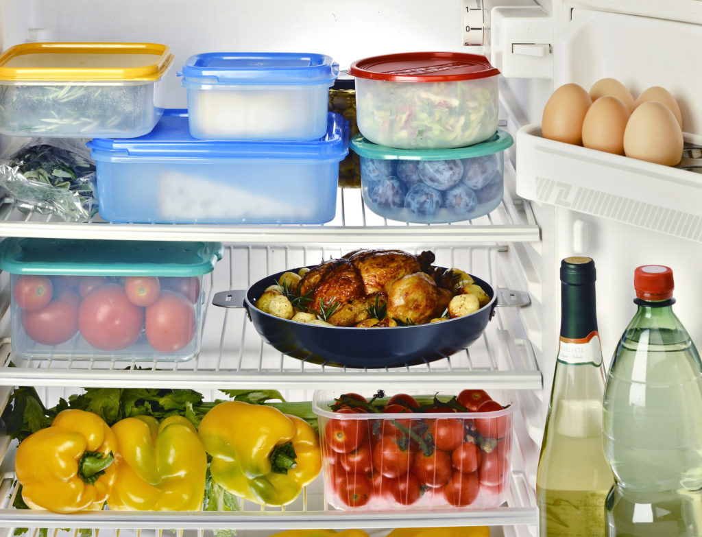 Open Refrigerator with Assortment of Food and Beverages