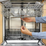 handyman repairing a dishwasher