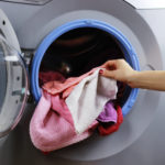 put cloth in washer